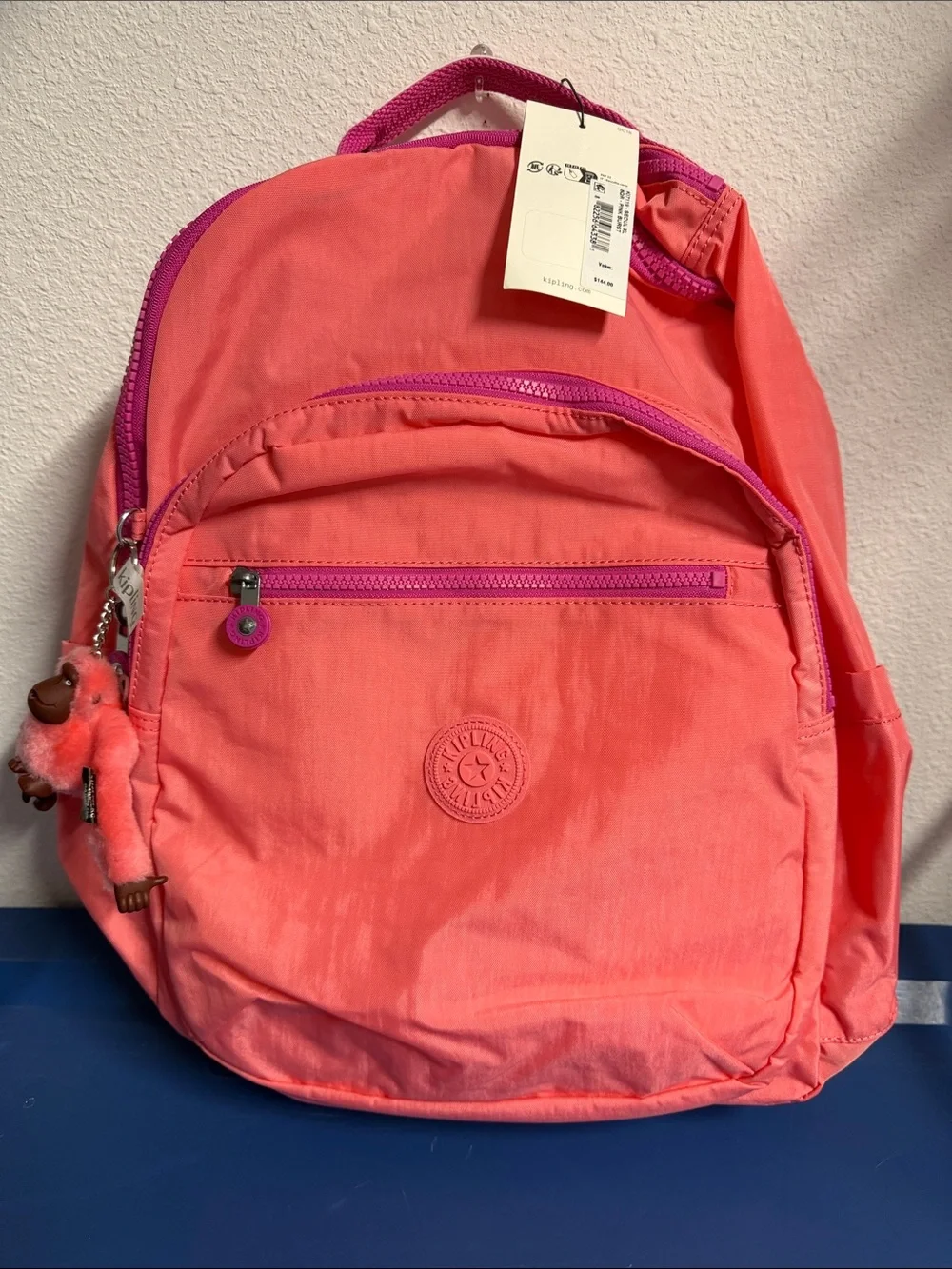 Kipling Coral Pink Backpack with Plush Monkey Charm